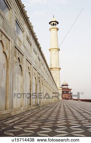 Low angle view of an ornate wall leading to a minaret, Taj Mahal, Agra, Uttar Pradesh, India View Large Photo Image Stock Photo - Low angle view of an ornate wall leading to a minaret, Taj Mahal, Agra, Uttar Pradesh, India. Fotosearch