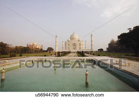 Stock Image - Pond in front of a mausoleum, Taj Mahal, Agra, Uttar Pradesh, India. Fotosearch