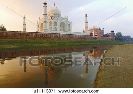 Stock Image - Reflection of a mausoleum in the river, Taj Mahal, Agra, Uttar Pradesh, India. Fotosearch