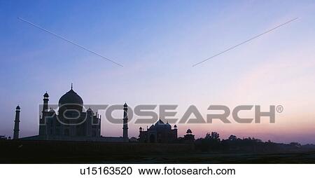 Stock Image - Silhouette of a mausoleum, Taj Mahal, Agra, Uttar Pradesh, India. Fotosearch