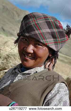 Stock Photo - Portrait of a mature woman in a hilly area.. Fotosearch