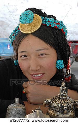 Stock Image - Portrait of a woman with decorated ornament.. Fotosearch