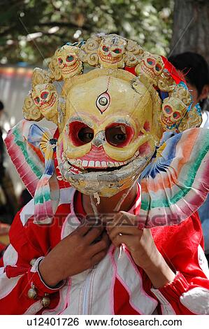 Stock Photograph - View of a person wearing a skeleton mask.. Fotosearch