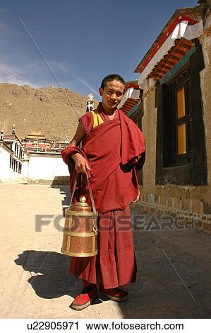 Stock Image - View of a young Buddhist lama.. Fotosearch