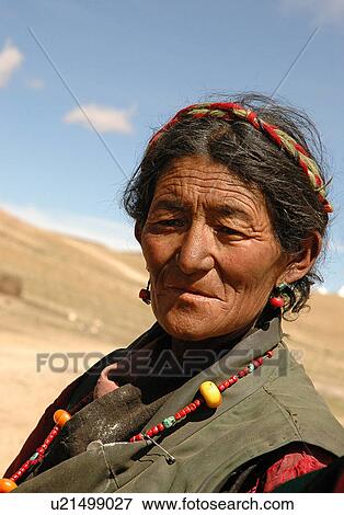 Stock Photo - View of an old woman looking away.. Fotosearch