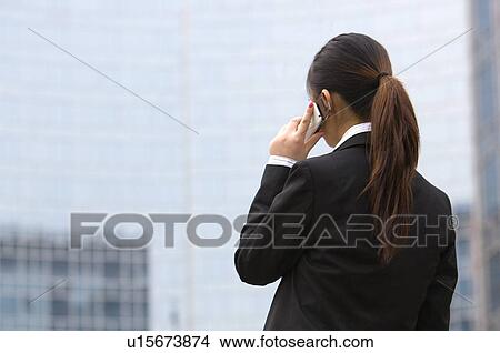 Business woman on the phone View Large Photo Image Picture - Business woman on the phone. Fotosearch