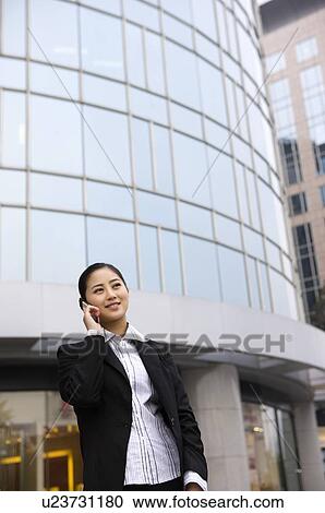 Stock Image - Business woman on the phone. Fotosearch