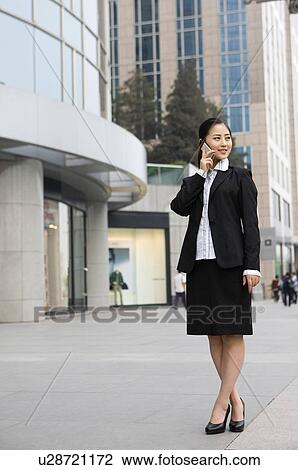 Stock Image - Business woman on the phone. Fotosearch