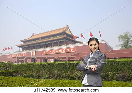 Business woman posing before Tiananmen Square View Large Photo Image Stock Photo - Business woman posing before Tiananmen Square. Fotosearch