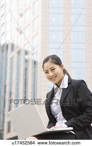 Business woman using laptop View Large Photo Image Picture - Business woman using laptop. Fotosearch