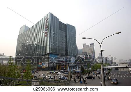Stock Photograph - Modern building at the corner of a busy street in Zhongguancun, Beijing, China. Fotosearch