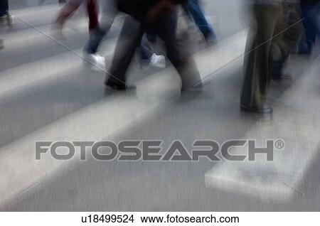 Pedestrians walking on the sidewalk View Large Photo Image Picture - Pedestrians walking on the sidewalk. Fotosearch