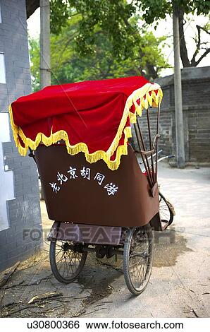 Stock Photograph - Rickshaw parking in the street. Fotosearch
