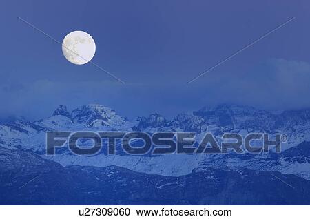 Stock Image - full moon, Alps, eerie, dusk, Central Switzerland, huwiler, alpenpanorama. Fotosearch