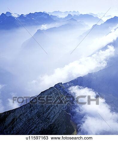 Stock Image - wolkenmeer, aerial perspective, alpenlandschaft, alpenpanorama, Alps, areal picture, Central Switzerland. Fotosearch