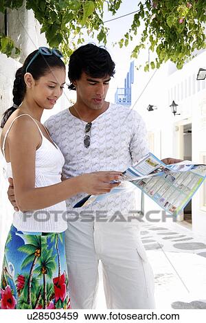 Stock Photo - Couple looking at map. Fotosearch