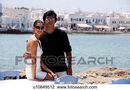 Couple posing with sea view View Large Photo Image Stock Image - Couple posing with sea view. Fotosearch