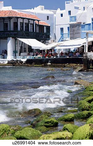People sitting at seaside restaurant tables View Large Photo Image Picture - People sitting at seaside restaurant tables. Fotosearch