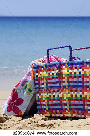 Beach bag with towel on beach View Large Photo Image Picture - Beach bag with towel on beach. Fotosearch