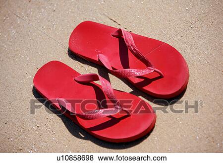 Stock Photo - Flip flops on the beach. Fotosearch