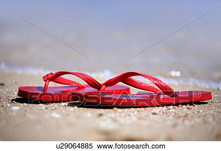 Flip flops on the beach View Large Photo Image Stock Photography - Flip flops on the beach. Fotosearch