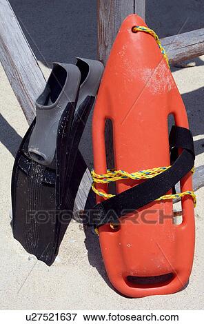 Stock Photo - Flippers on the beach. Fotosearch