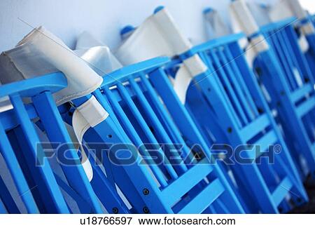 Row of folded chairs View Large Photo Image Stock Photo - Row of folded chairs. Fotosearch