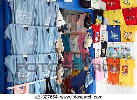 Picture - Tee shirts displayed for sale. Fotosearch