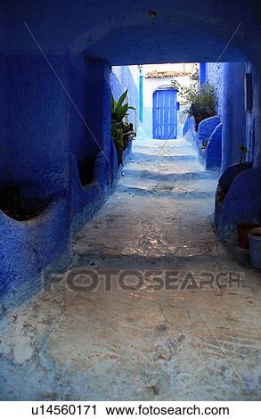 Stock Image - Doorway at end of alley. Fotosearch