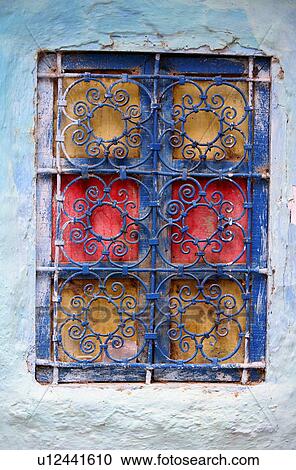Painted window with wrought ironwork View Large Photo Image Stock Image - Painted window with wrought ironwork. Fotosearch