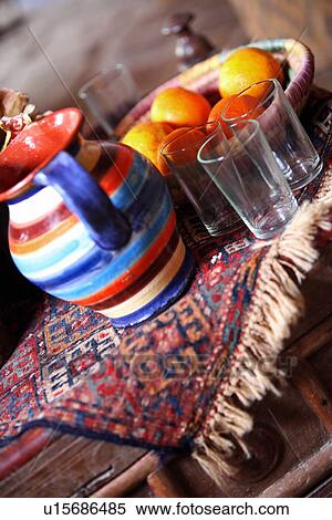 Stock Photography - Table with jug and bowl of fruit. Fotosearch