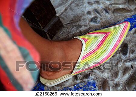Stock Photograph - Woman's foot with Moroccan slipper. Fotosearch