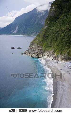 Stock Photo - Beach by the sea on a cloudy day, Hualien County, Taiwan. Fotosearch