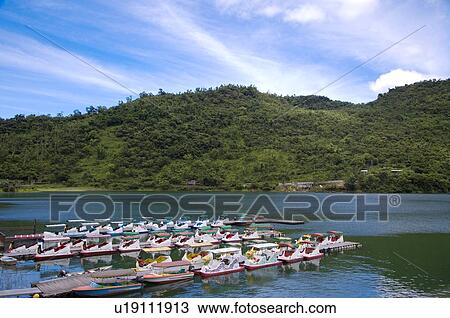 Stock Image - Little boats on Carp Lake in Hualien County, Taiwan. Fotosearch
