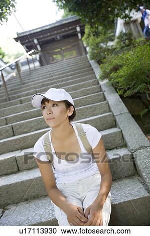 A young woman sitting on steps at Nanzenji Temple, Kyoto, Japan View Large Photo Image Stock Image - A young woman sitting on steps at Nanzenji Temple, Kyoto, Japan. Fotosearch