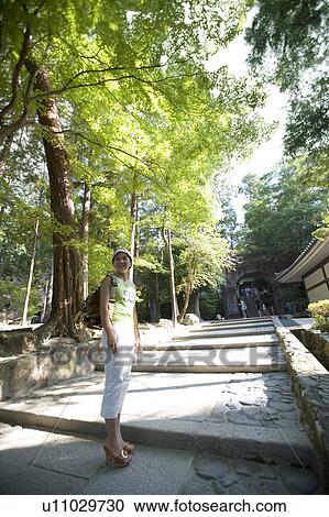 A young woman standing on approach of Nanzenji Temple, Kyoto, Japan View Large Photo Image Stock Image - A young woman standing on approach of Nanzenji Temple, Kyoto, Japan. Fotosearch
