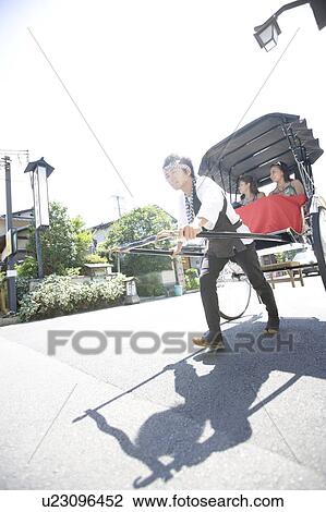 Two young women sitting in rickshaw View Large Photo Image Stock Image - Two young women sitting in rickshaw. Fotosearch