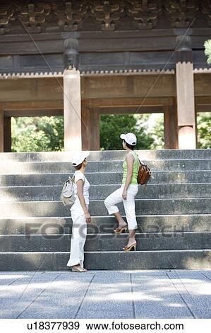 Two young women standing on steps at Nanzenji Temple, Kyoto, Japan View Large Photo Image Stock Photo - Two young women standing on steps at Nanzenji Temple, Kyoto, Japan. Fotosearch