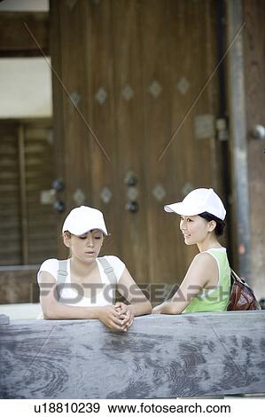 Stock Photo - Two young women talking at Nanzenji Temple, Kyoto, Japan. Fotosearch