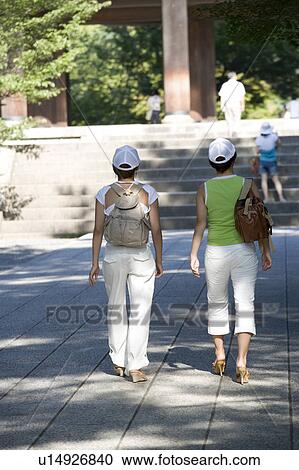 Stock Image - Two young women visiting Nanzenji Temple, Kyoto, Japan. Fotosearch