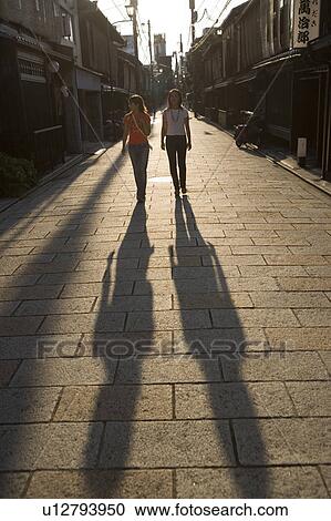 Two young women walking in Gion, Kyoto, Japan View Large Photo Image Stock Image - Two young women walking in Gion, Kyoto, Japan. Fotosearch