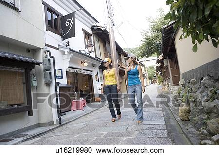 Two young women walking in Gion, Kyoto, Japan View Large Photo Image Stock Image - Two young women walking in Gion, Kyoto, Japan. Fotosearch