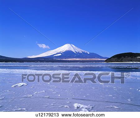 Stock Image - Frozen lake in front of Mt Fuji. Fotosearch