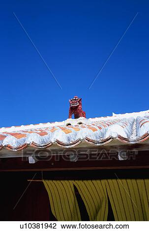 Lion shaped roof ornament of Okinawa Prefecture, Taketomi Island View Large Photo Image Stock Image - Lion shaped roof ornament of Okinawa Prefecture, Taketomi Island. Fotosearch