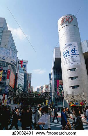Stock Image - People crossing street in Shibuya, Tokyo, Japan. Fotosearch