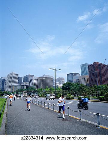 Picture - People jogging around Imperial Palace, Tokyo, Japan. Fotosearch