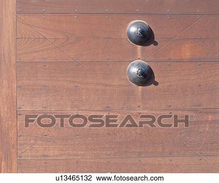 Stock Image - Close-up of wooden door. Fotosearch