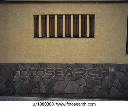 Stock Image - Small window on wall. Fotosearch