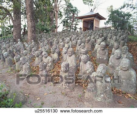 Stock Image - Stone Buddha in a row. Fotosearch