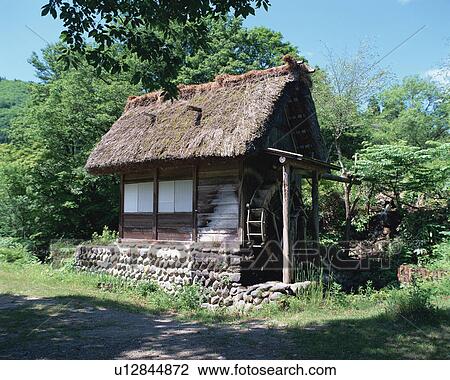 Stock Image - Straw roof house. Fotosearch